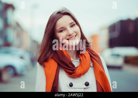 Happy and successful. Woman smiling outdoors blurred city on background in Brussels Belgium Stock Photo