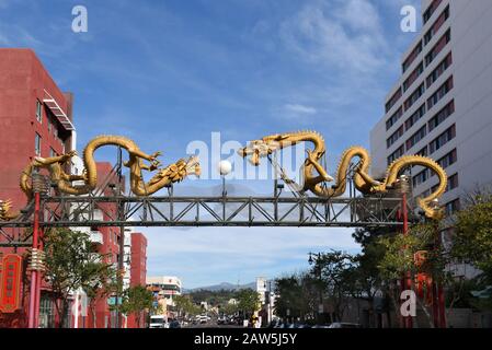 LOS ANGELES, CALIFORNIA - 05 FEB 2020: Twin Dragon Gate on Broadway leads into the heart of Chinatown. Chinese characters translate to Welcome. Stock Photo