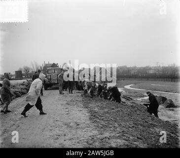 Severe weather over the Netherlands. Dike breakthroughs, flooding  [with might and is working on closing a dike] Date: February 1, 1953 Keywords: storm Stock Photo