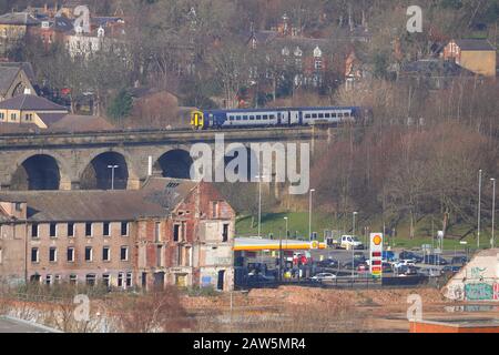 A Northern Rail passenger train travels over Kirkstall Viaduct in Leeds Stock Photo