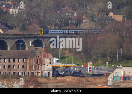 A Northern Rail passenger train travels over Kirkstall Viaduct in Leeds Stock Photo