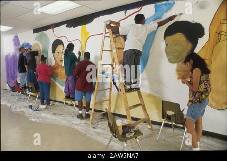 Austin, Texas USA: Teens working on mural inside high school for summer project.  ©Bob Daemmrich Stock Photo