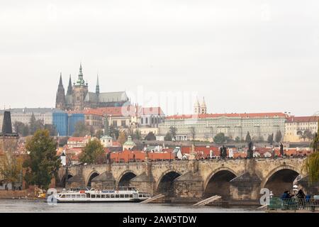 PRAGUE, CZECHIA - NOVEMBER 1, 2019: Charles bridge (Karluv Most) and the Prague Castle (Prazsky hrad) seen from the Vltava river. The castle is the ma Stock Photo