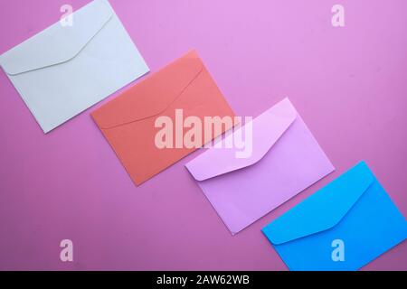 top view of colorful envelopes on pink background  Stock Photo