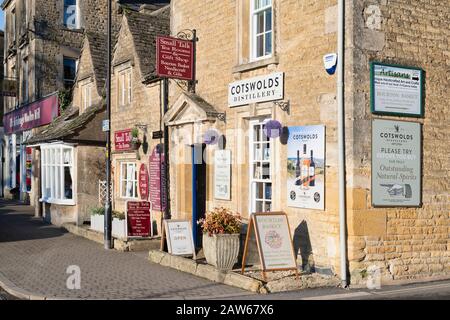 The cotswolds distillery shop in the afternoon winter sunlight. Bourton on the Water, Cotswolds, Gloucestershire, England Stock Photo