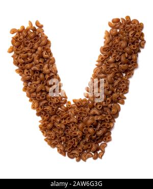 Letter V of the English alphabet from dry pasta from buckwheat amaranth flour   on a white isolated background. Food pattern made from macaroni tubes. Stock Photo