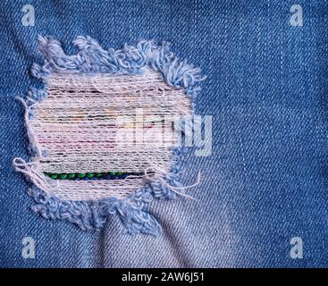 The Denim Jeans Ripped Destroyed Torn Blue Patch Stock Photo
