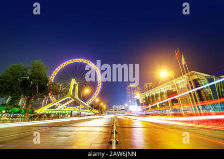 Night scene cityscape of Tianjin ferris wheel,Tianjin eyes in twilight time.Most Modern and popular landmark in Tianjin city. Stock Photo