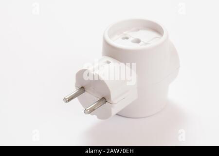 Plastic electrical tee connector with three sockets on a white background. Stock Photo