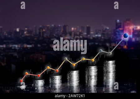 Double exposure of city and rows of coins for finance and business concept. Concept in grow and walk step by step for success in business Stock Photo