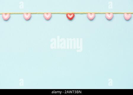 Valentine's Day background. Pink hearts on pastel blue background. Valentines day concept. Flat lay, top view, copy space Stock Photo