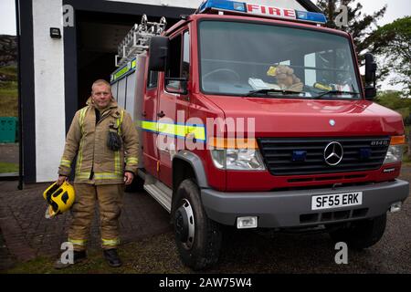 Volunteer fire fighter Les Robinson pictured during a training drill on the the Inner Hebridean island of Colonsay on Scotland's west coast.  The island is in the council area of Argyll and Bute and has an area of 4,074 hectares (15.7 sq mi). Aligned on a south-west to north-east axis, it measures 8 miles (13 km) in length and reaches 3 miles (4.8 km) at its widest point, in 2019 it had a permanent population of 136 adults and children. Stock Photo