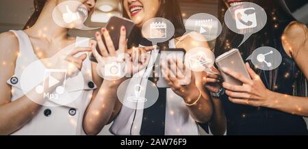 Multimedia and Computer Applications Concept. Business people using technology of digital gadget with modern graphic interface showing social, shoppin Stock Photo