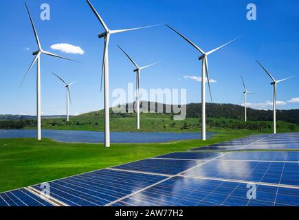Solar energy panel photovoltaic cell and wind turbine farm power generator in nature landscape for production of renewable green energy is friendly in Stock Photo