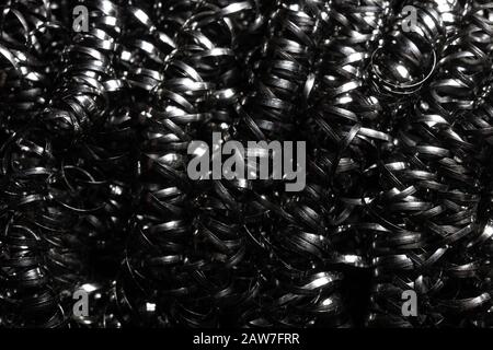 Close-up of twisted spiral steel shavings, metal sponge Stock Photo