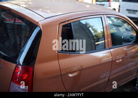 Broken smashed window on a car at metaxourgeio Athens Stock Photo