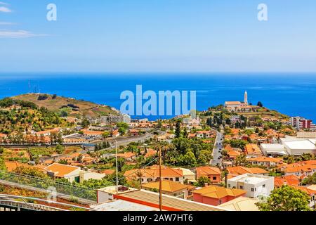 Funchal, Madeira - June 7, 2013: South coast of Funchal -view over the capital city of Madeira, district Sao Martinho with civila parish church. View Stock Photo