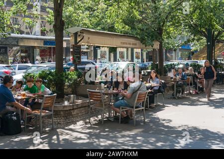 Prague, Czech Republic - May 21, 2018: People having their meal in outdoor restaurant in Prague Stock Photo