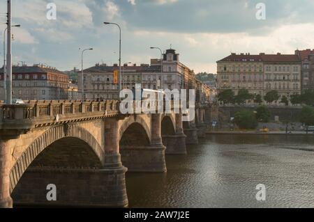 Prague, Czech Republic - May 22, 2018: Tramway moving on old bridge over Vltava river in Prague Stock Photo