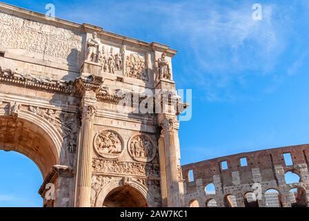 Arch of Constantine and Colosseum in Rome, Italy. Triumphal arch in Rome, Italy. North side, from the Colosseum. Colosseum is one of the main attracti Stock Photo