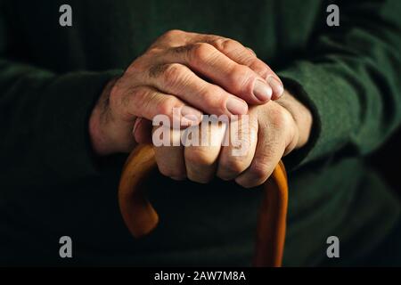 Gnarled arthritic fingers of an old man Stock Photo