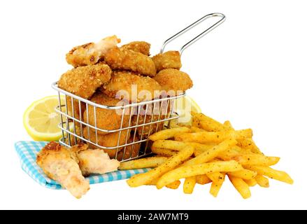 Breadcrumb fried scampi in a small wire frying basket with French fries isolated on  a white background Stock Photo