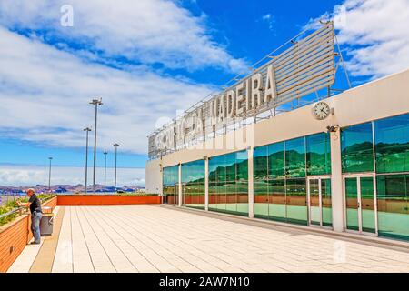 Santa Cruz, Madeira, Portugal - June 9, 2013: Airport Madeira (Aeroporto  da Madeira) - logo / lettering at the panorama terrace. Sourrounding landsca Stock Photo