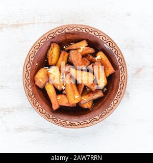Potatoes fried with garlic. Ukrainian Traditional Cuisine. Top view. Free space for your text. Rustic style. Stock Photo