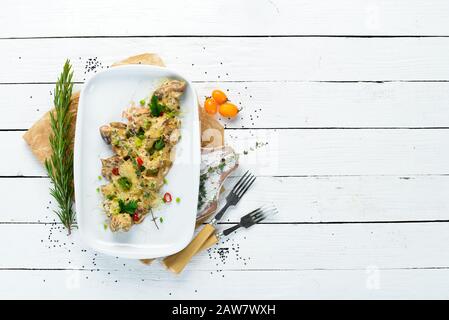 Chicken liver, heart and stomach in cream sauce. Restaurant dishes. Top view. Free copy space. Stock Photo