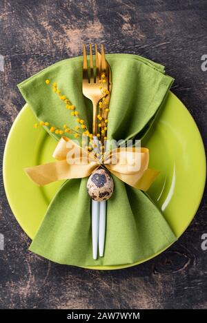Easter table setting with green plate Stock Photo