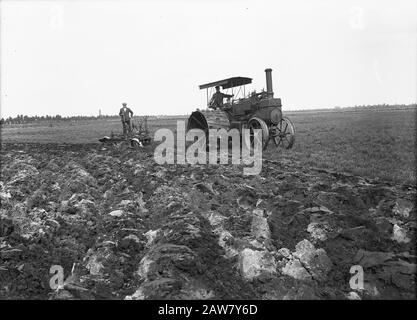 mining, soil, leveling, sanding, plowing, men, caterpillar Date: 1915 Keywords: sanding, caterpillar, leveling, soil preparation, men, mining, plowing   Copyright Holder: National Archives Material Type: Glass Negative archival inventory number: see access 2.24.06.02 Stock Photo