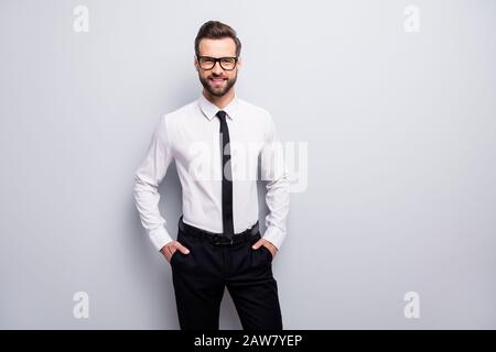 Photo of handsome macho business man toothy beaming smiling friendly chief hands in pockets wear specs white office shirt black pants tie isolated Stock Photo