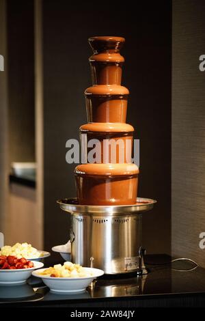 Chocolate fountain on a buffet table Stock Photo