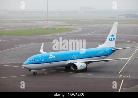 KLM airplane in the Amsterdam Schiphol Airport, dutch flight carrier using Boeing 737 aircrafts. Stock Photo