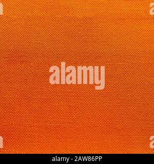 Rustic canvas fabric texture in orange magenta color. Stock Photo