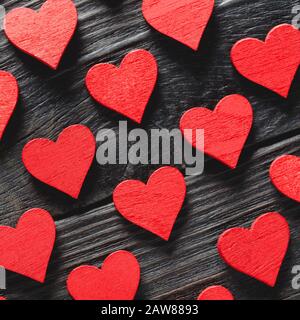 Happy Valentine's day hearts on dark wooden background. Love concept for mother's day and valentine's day. Stock Photo