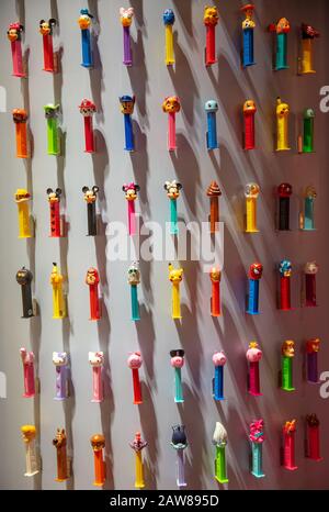 COLOGNE, February 2020: Many PEZ dispenser characters on display at ISM trade fair Stock Photo