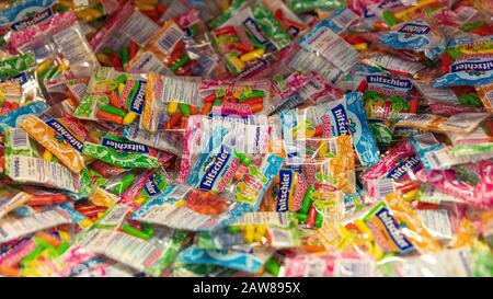 COLOGNE, February 2020: Many colorful hitschler brand sweets on ISM trade fair Stock Photo