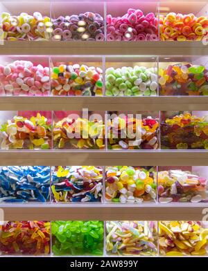 Many colorful sweets on display for pick and mix in a candy shop Stock Photo