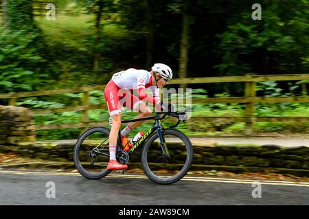 Polish junior male road racing cyclist, riding bike at speed on country lane, competing in cycle race - UCI World Championships, North Yorkshire,UK.
