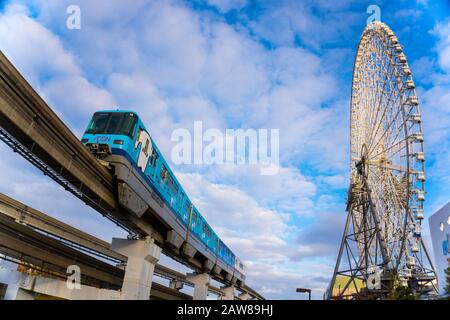 Osaka, Japan - 13 December 2019 : Redhorse OSAKA WHEEL and Osaka Monorail, Low Angle View Stock Photo