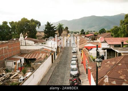 Aerial street view and colonial houses from atop Cafe Sky bar, 1a Avenida Sur, Antigua, Guatemala. Jan 2019 Stock Photo