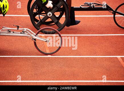 Close-up of the wheels of bike wheelchair for disabled sportsman people during sport competition Stock Photo