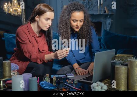 Lady focusing her attention on a laptop Stock Photo