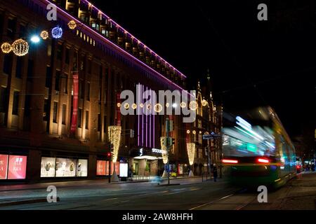 Helsinki, Finland - January 21, 2020: Tramway traffic in front of the department store Stockmann decorated with winter lights. Stock Photo