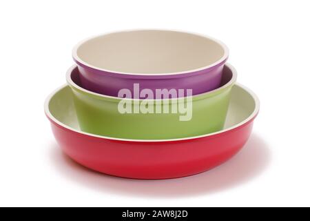 Set of ceramic cooking kitchen pans on white isolated background. Stock Photo