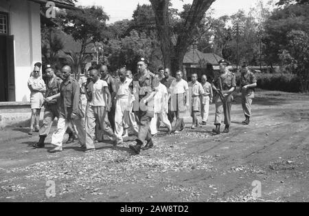 Prisoner of British Indians and Japs  Medan. Imprisoned Indian and Japanese deserters are after their interrogation under MP guard at the prison returned Date: August 1, 1947 Location: Indonesia, Dutch East Indies, Sumatra Stock Photo
