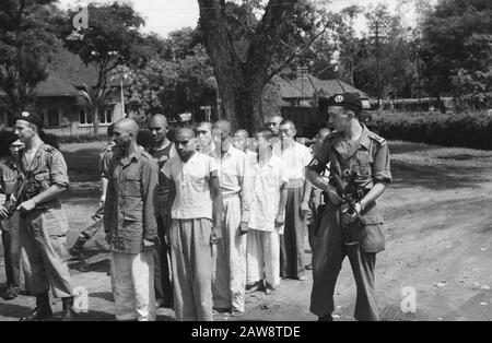 Prisoner of British Indians and Japs  Medan. Imprisoned Indian and Japanese deserters are after their interrogation under MP guard at the prison returned Date: August 1, 1947 Location: Indonesia, Dutch East Indies, Sumatra Stock Photo