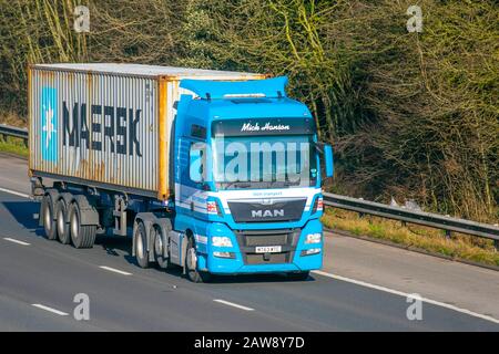 Maersk heavy bulk Haulage delivery trucks, haulage, lorry, transportation, truck, cargo, MAN vehicle, delivery, transport, industry, freight on the M61 at Manchestere, UK Stock Photo