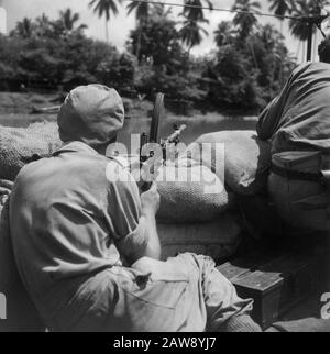 [Patrol boat on a river. Bren Gunner behind sandbags] Date: 01/01/1947 Location: Indonesia Dutch East Indies Stock Photo